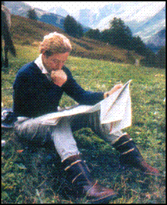 Long Rider Jeremy James studys his map during his ride across Italy.tif